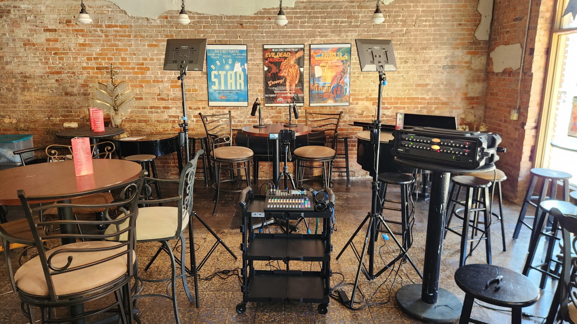 Studio in Bay Street for the Podcast by Center Stage 1. Light and Sound mixing equipment set up in front of the brick wall in the theatre's VIP room.
